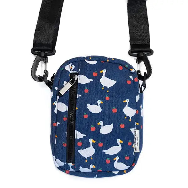 Goose print crossbody bag by Three Potato Four featuring a playful duck design and adjustable strap