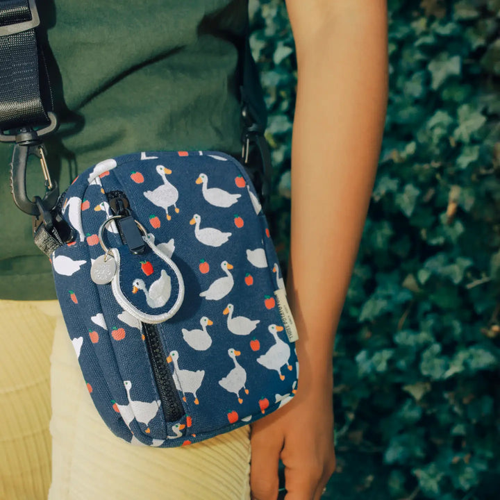 Goose print crossbody bag featuring a colorful design with ducks and adjustable strap, ideal for casual outings
