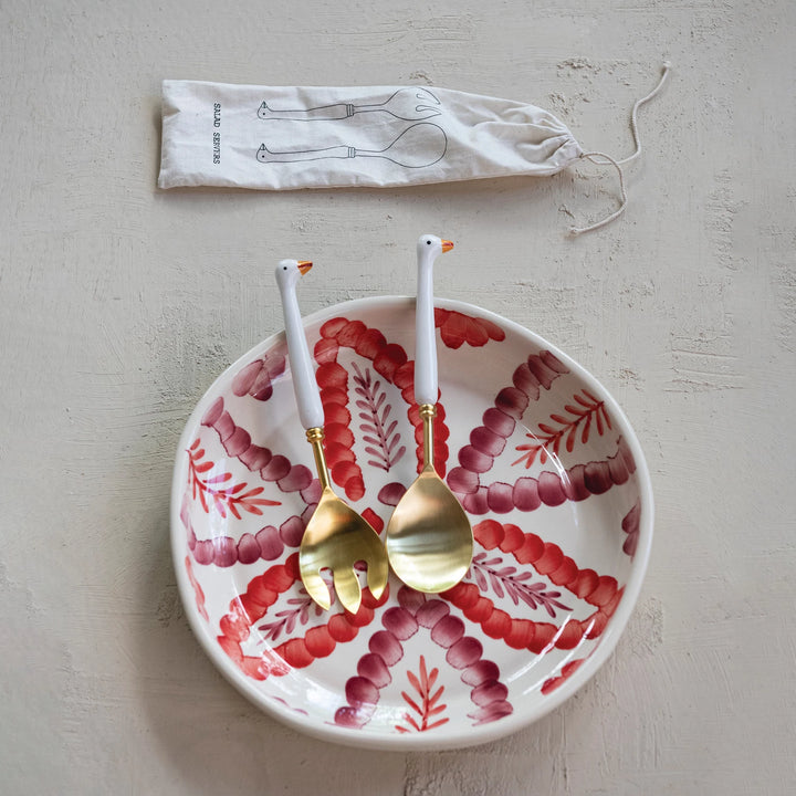 Creative Co-Op goose salad servers in a decorative bowl with a unique design