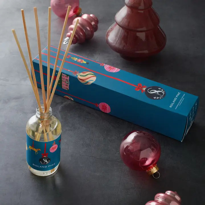 Soap & Paper Factory holiday reed diffuser in pine scent with elegant packaging and festive ornaments