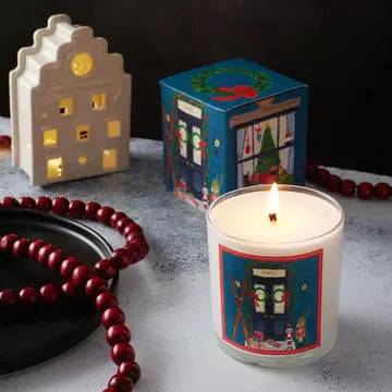 Home for the holidays candle by Soap & Paper Factory with festive winter design and warm glow