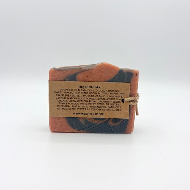 Insight Soap and Body exfoliating bar soap with charcoal orange and black swirled bar wrapped with kraft label