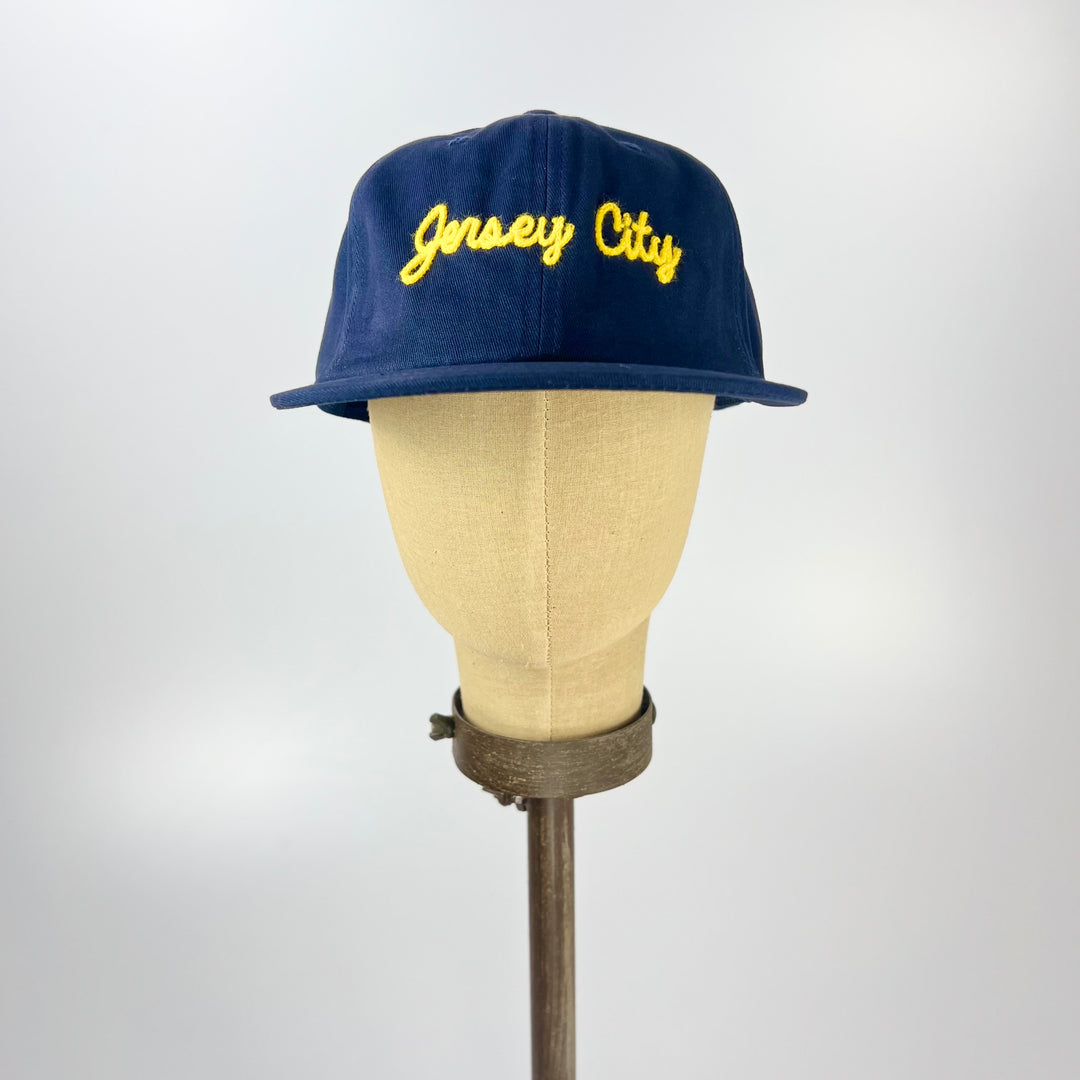 Navy Weld MFG Jersey City embroidered hat with vibrant yellow lettering