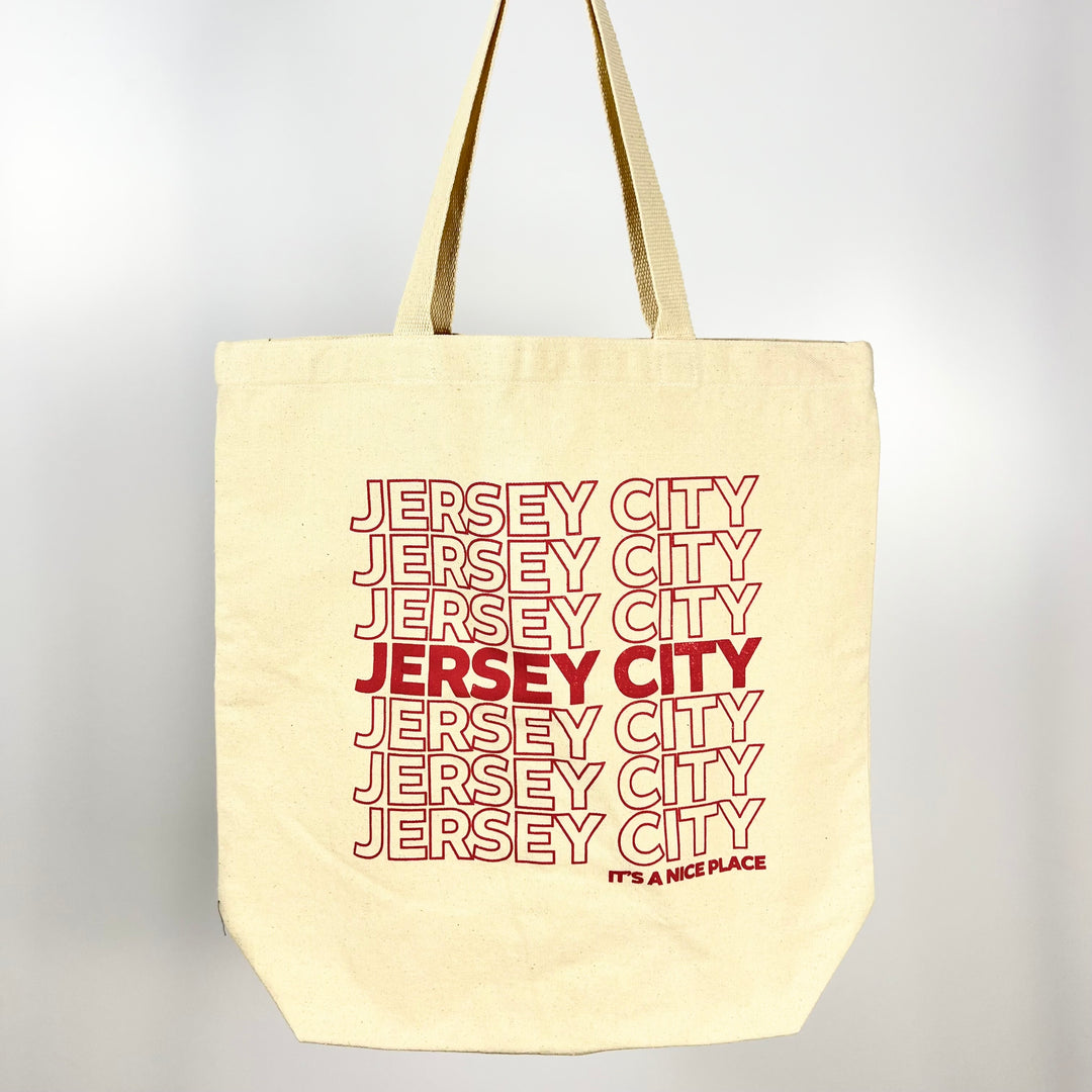 Jersey City tote bag by Vital Industries with repeated red text design on natural canvas fabric