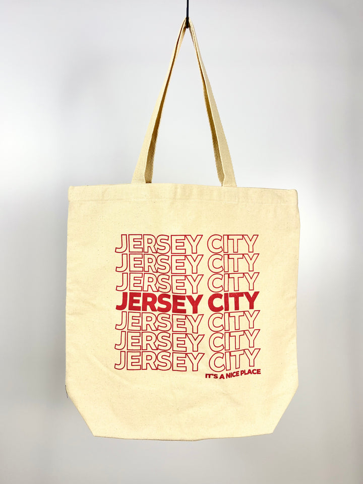 Vital Industries beige Jersey City tote bag with repeated red text design and long handles