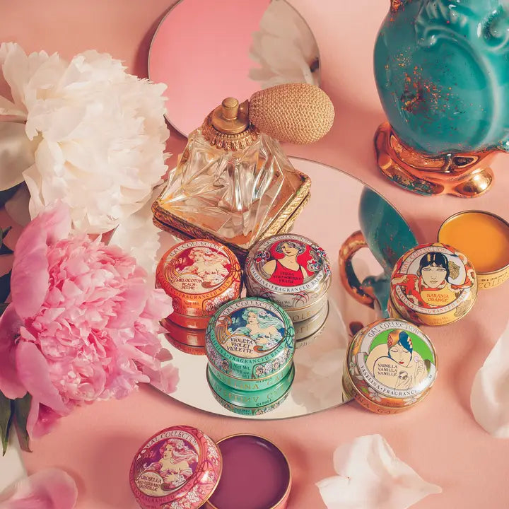 Kalastyle Soap Co red currant balm vintage tins on mirror with perfume atomizer and pink peonies
