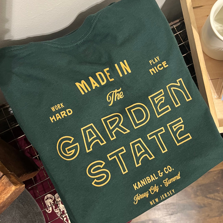 Green Garden State t-shirt by Kanibal & Co. with bold yellow text and relaxed fit