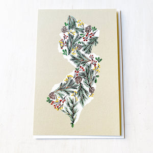 New Jersey holiday card with pine branches, pinecones, and berries illustration on textured beige background
