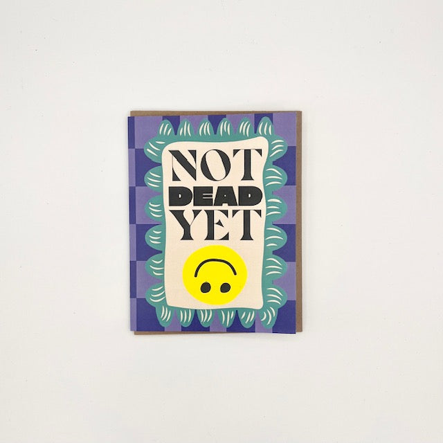 JamSauce Not Dead Yet birthday card with bold text and decorative blue and green border