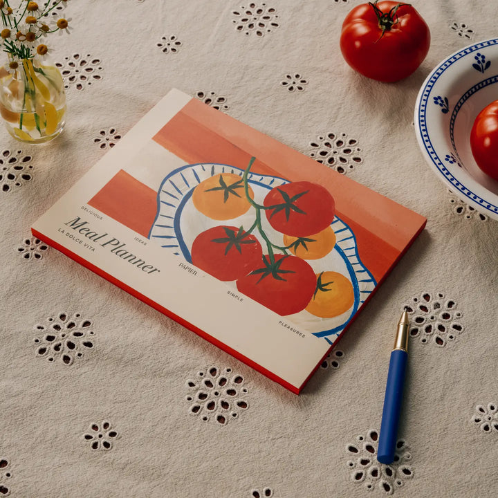 La Dolce Vita meal planner by Papier featuring colorful tomato illustrations on a stylish notebook