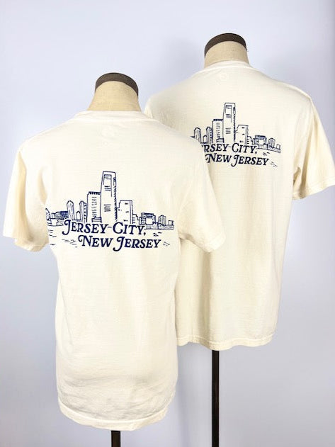 Nice Place Jersey City shirt by Kanibal Co in cream with navy city skyline graphic on back