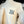 White Nice Place Jersey City shirt with front pocket and navy text It's a Nice Place printed on pocket