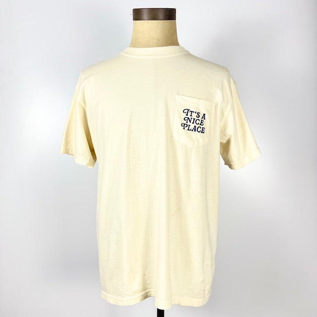 Cream Nice Place Jersey City shirt with front pocket and text It’s a Nice Place printed on the pocket