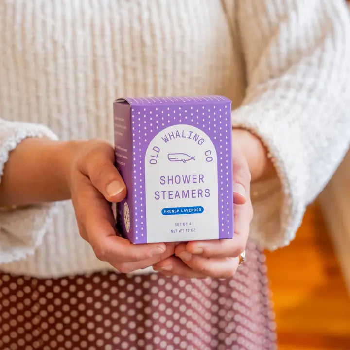 Old Whaling Co French lavender shower steamers box held in hands showing purple packaging and label