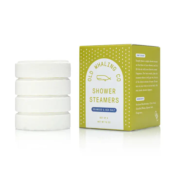 Old Whaling Co box and stacked white tablets of seaweed and sea salt shower steamers for coastal spa