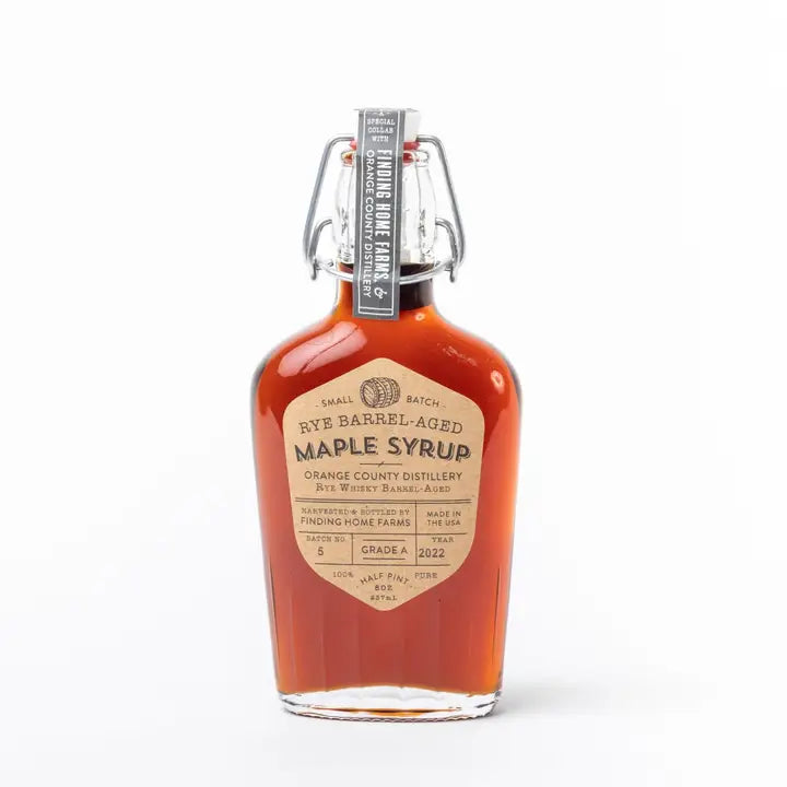 Finding Home Farms rye barrel aged maple syrup in a glass bottle with a unique label