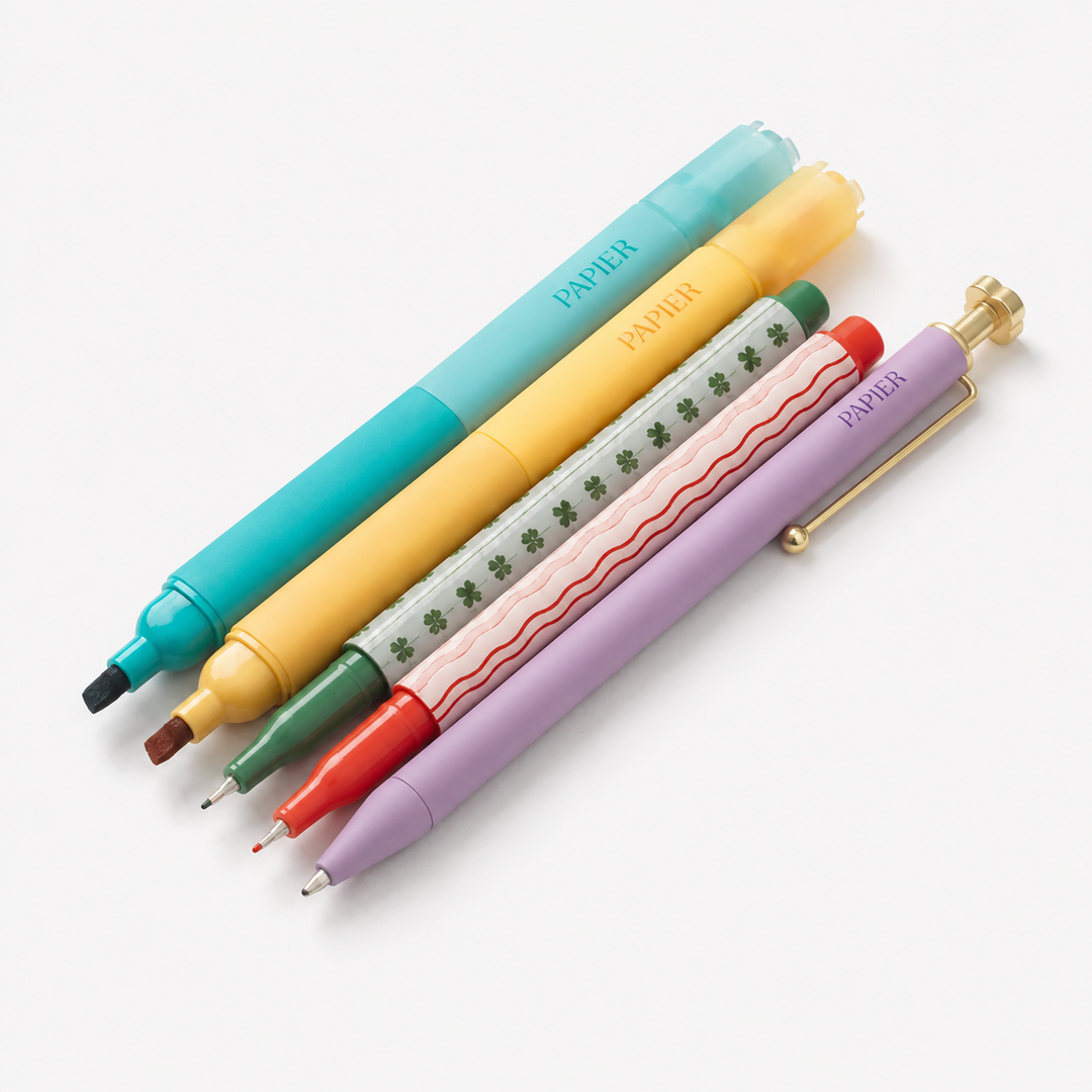 Four Papiél mechanical pencils in pastel colors with unique designs, arranged diagonally on a clean white background.