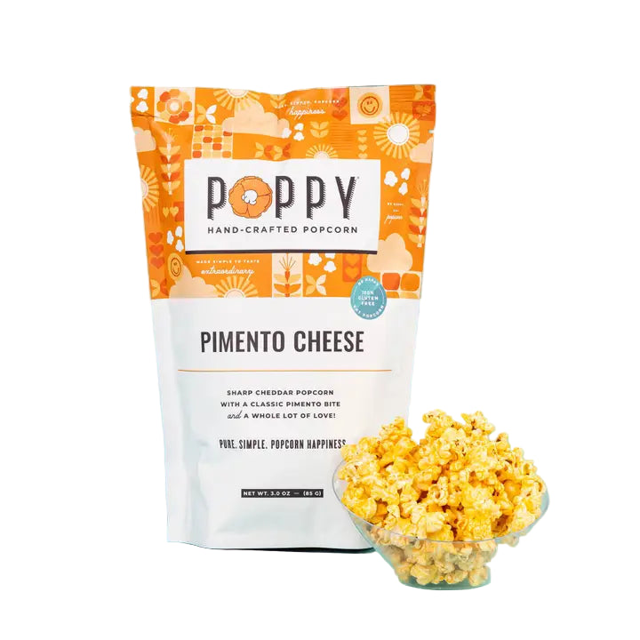 Poppy Handcrafted Popcorn Pimento Cheese popcorn in a bag and a bowl showcasing the savory snack