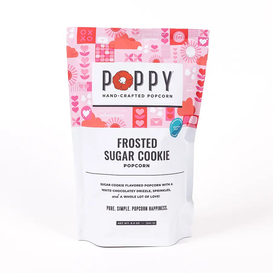 Poppy Handcrafted Popcorn in Frosted Sugar Cookie flavor with white chocolate drizzle and sprinkles