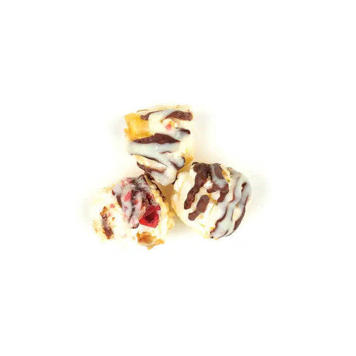 Poppy Handcrafted Popcorn peppermint bark popcorn with chocolate drizzles and festive toppings