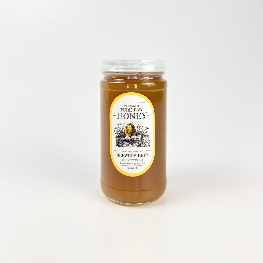 Brewers Bees pure raw honey 1lb jar featuring a classic design with a golden color