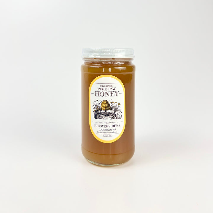Brewers Bees pure raw honey 1lb jar featuring a classic design with a golden color