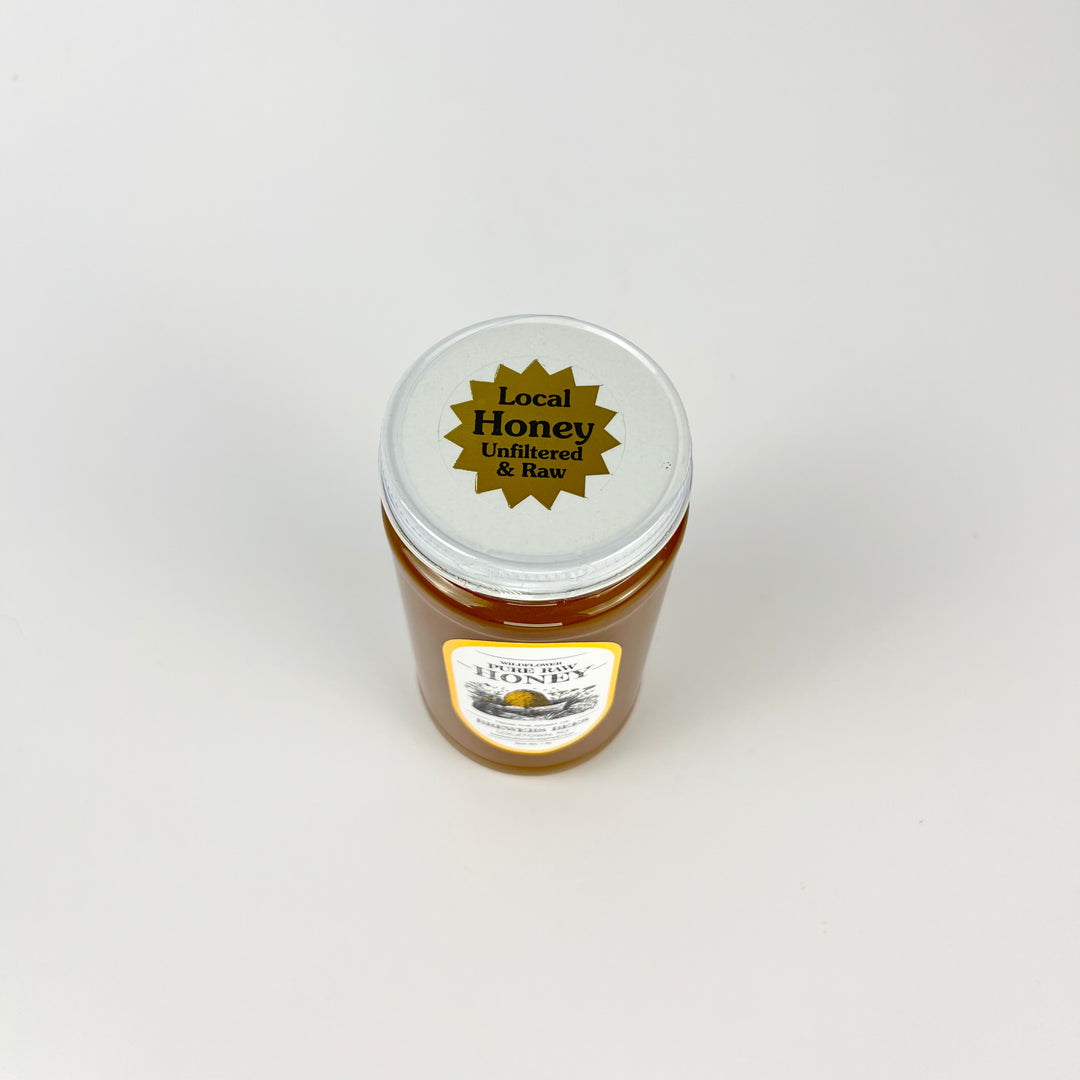 Brewers Bees pure raw honey 1lb jar with a label stating Local Honey Unfiltered and Raw