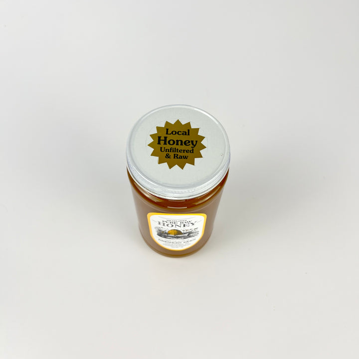 Brewers Bees pure raw honey 1lb jar with a label stating Local Honey Unfiltered and Raw