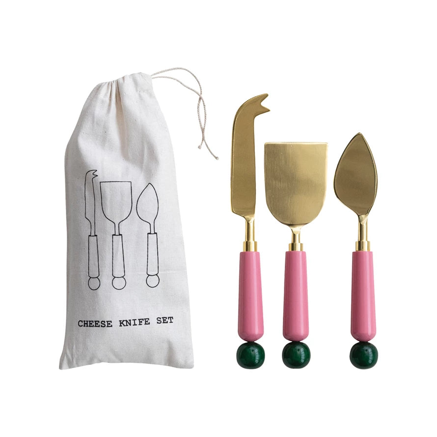 Creative Co-Op resin cheese knife set in a pouch with pink handles and gold blades for serving cheese