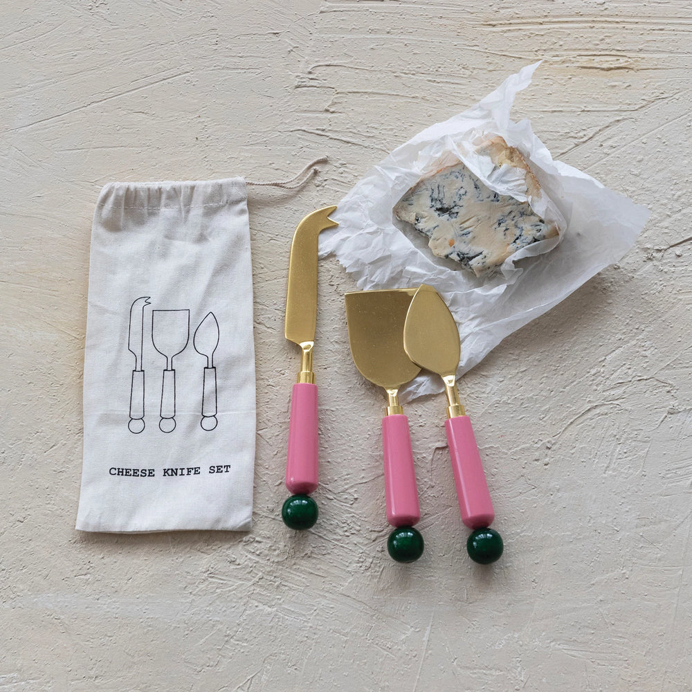 Creative Co-Op resin cheese knife set with gold accents and colorful handles for serving cheese