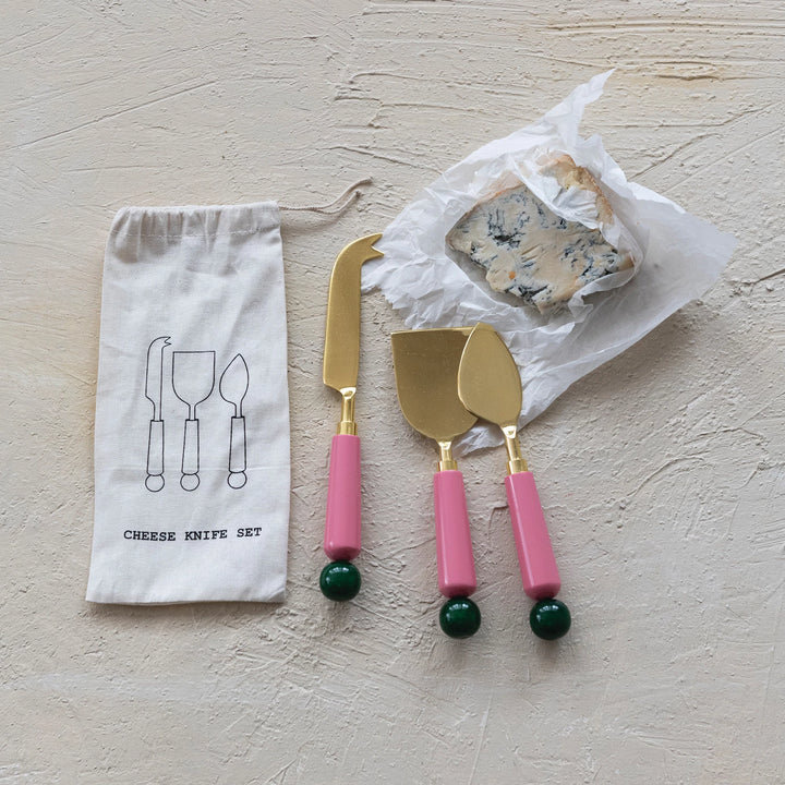 Creative Co-Op resin cheese knife set with gold accents and colorful handles for serving cheese