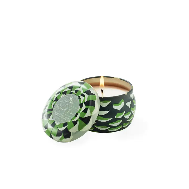 Roland Pine candle tin small with decorative green design and lit wick for a cozy ambiance