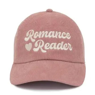 Pink corduroy hat featuring the phrase romance reader in stylish lettering