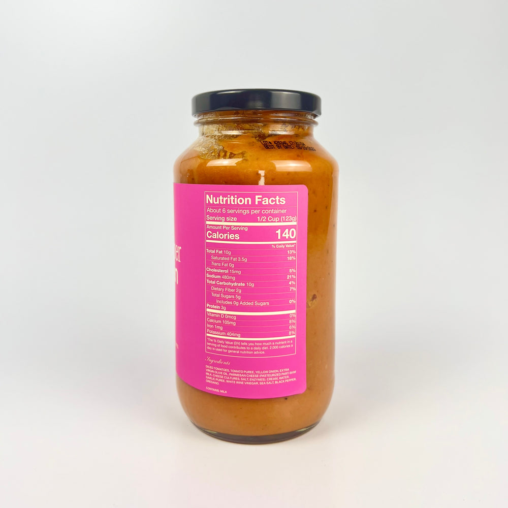 Sauz jar of cracked pepper parmesan pasta sauce with black lid and pink nutrition label visible