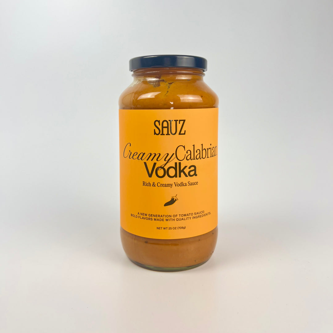 Sauz jar of creamy calabrian vodka pasta sauce in glass jar with orange label rich creamy vodka tomato