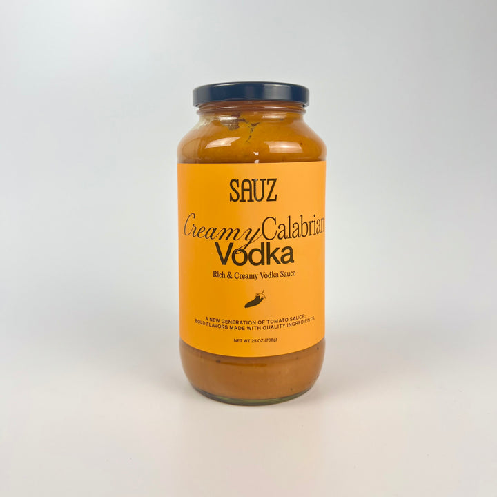 Sauz jar of creamy calabrian vodka pasta sauce in glass jar with orange label rich creamy vodka tomato