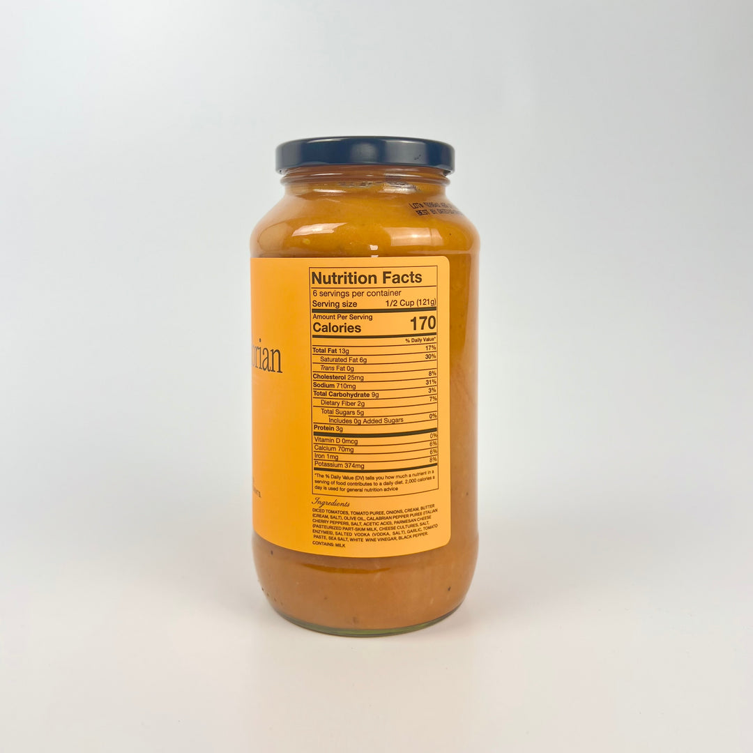 Sauz jar showing back nutrition label of creamy calabrian vodka pasta sauce in glass jar with navy lid