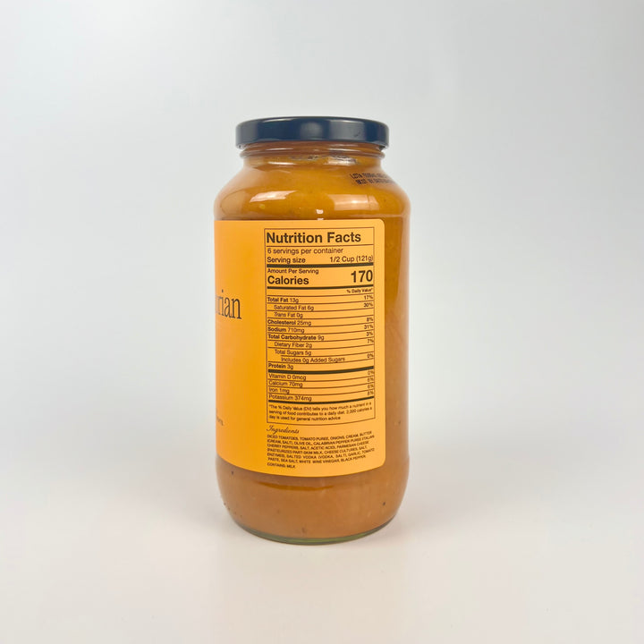 Sauz jar showing back nutrition label of creamy calabrian vodka pasta sauce in glass jar with navy lid