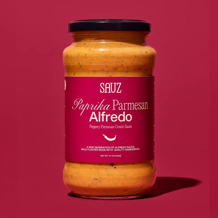Sauz Paprika Parmesan Alfredo Sauce in a jar with a vibrant label showcasing creamy flavor