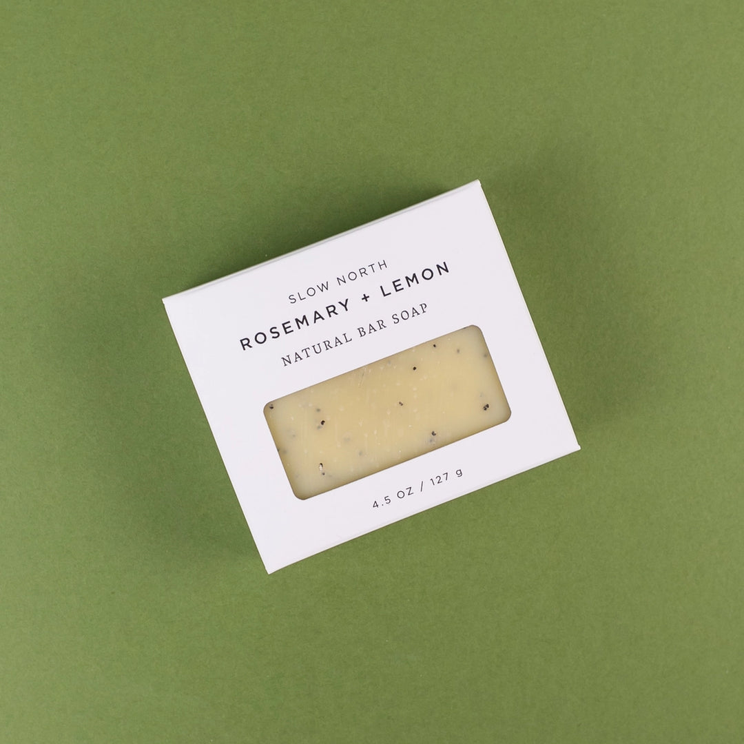 Slow North rosemary lemon bar soap in a white box with natural ingredients and a clear window