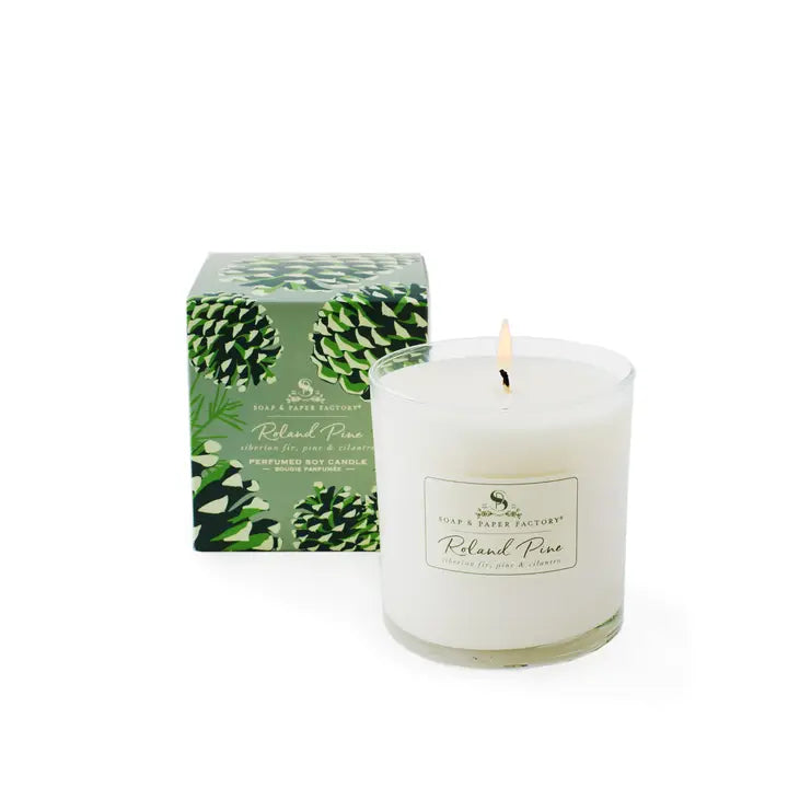 Roland Pine candle by Soap & Paper Factory in a glass jar with a decorative box featuring pinecones