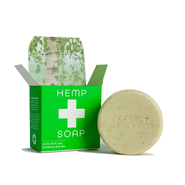 round bar of soap leaning against square packaging