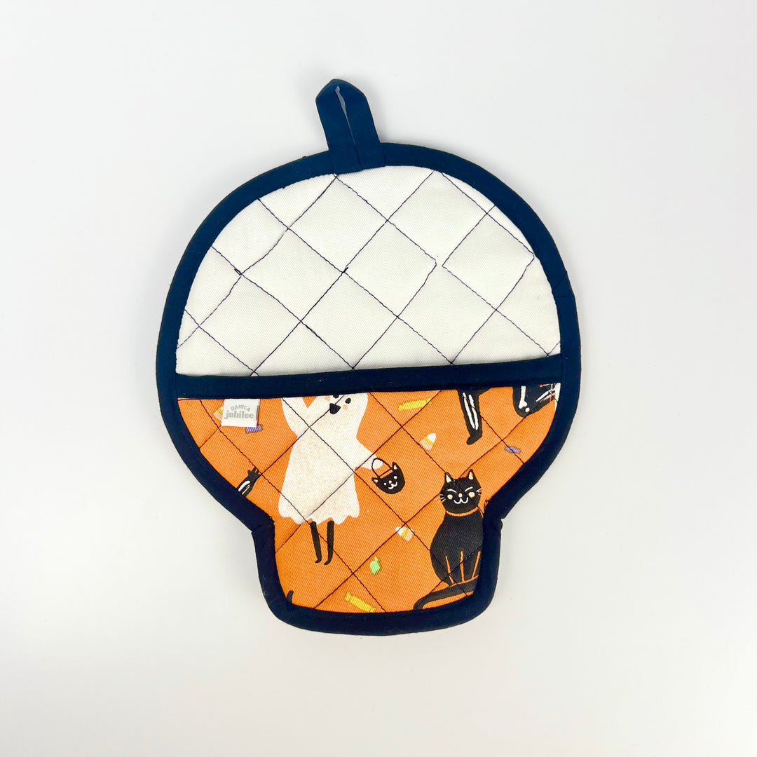 Danica skull pot holder shaped like a skull with orange ghost and black cat print white quilted back