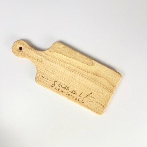 Wooden Summit New Jersey cutting board with handle and engraved design by Blue Studio Creative