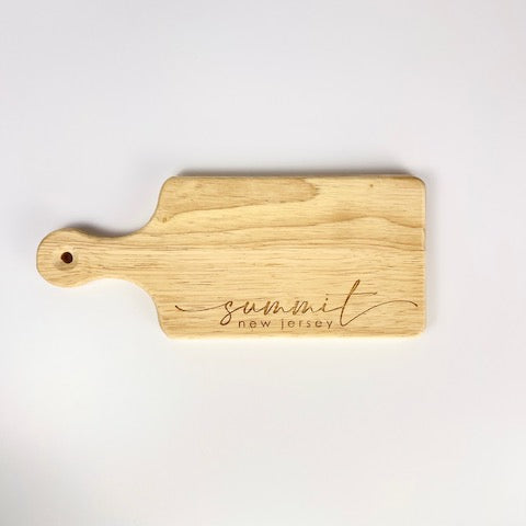 Wooden Summit New Jersey cutting board with handle and engraved script by Blue Studio Creative