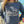 Kanibal & Co. Summit New Jersey sweatshirt with ram and tree graphic worn by woman outdoors