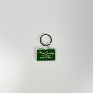 Acme New Jersey keychain with green rectangular tag and white text saying Its Not That Bad