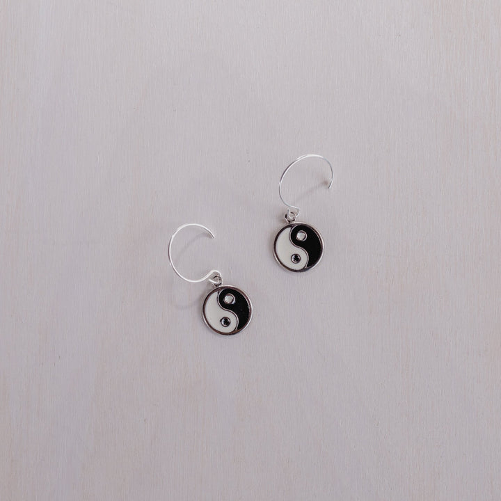 2 earrings with black and white yin yangs