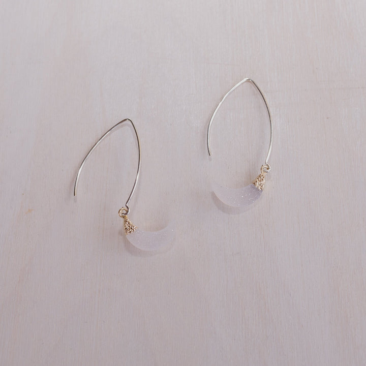 2 earrings with silver posts and crystal half moon charms