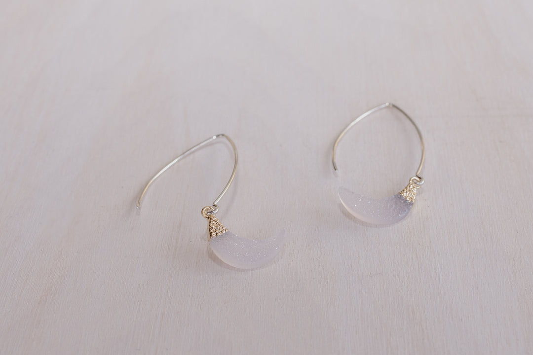 2 earrings with silver posts and crystal half moon charms
